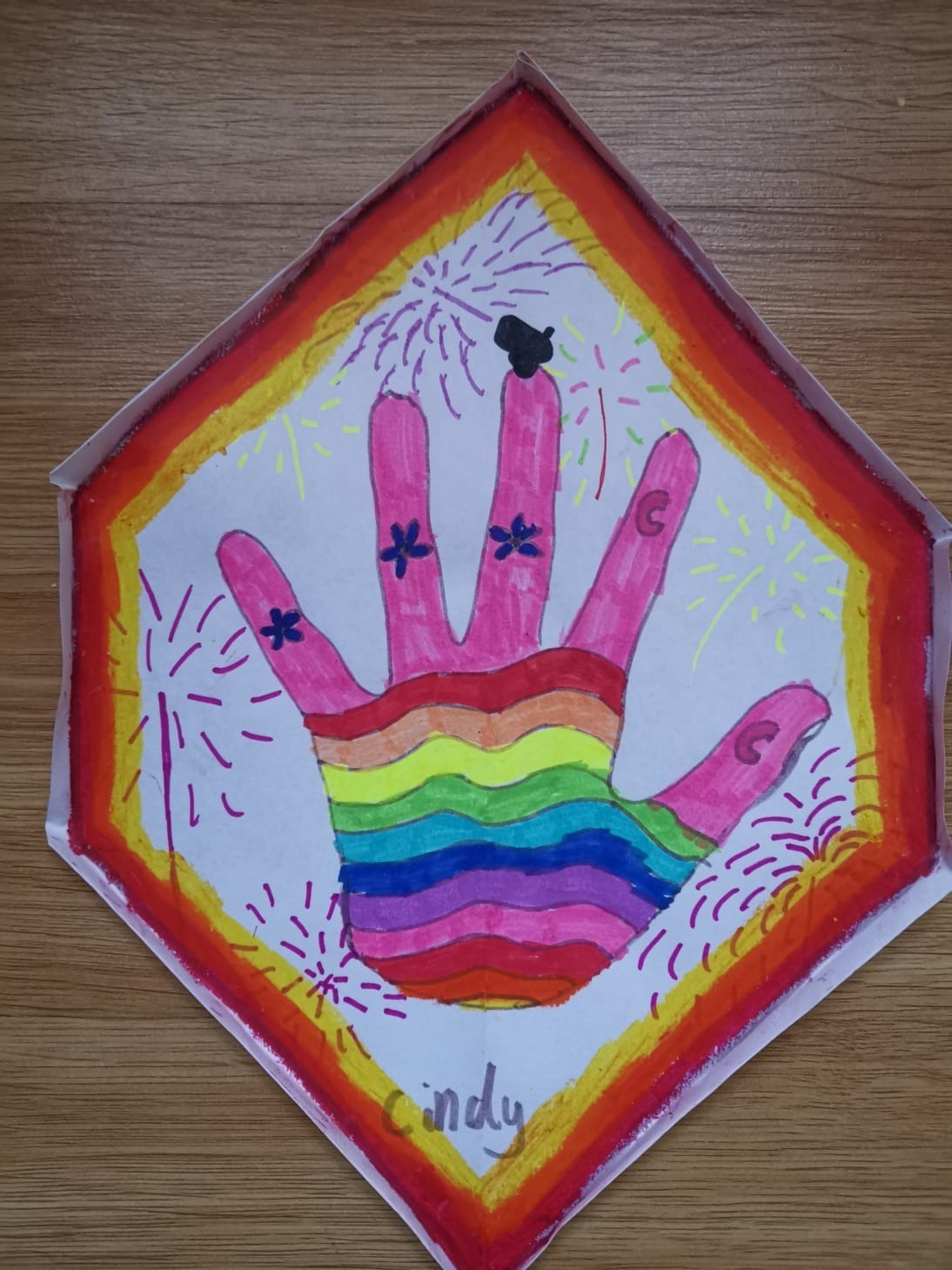 A brightly coloured hand by Cindy
